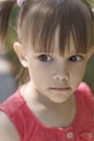 Portrait of an emotional 3-year-old girl with black expressive eyes