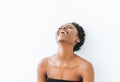 Portrait of emotional young African American woman in black top isolated on white background Royalty Free Stock Photo