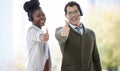 Portrait, employee and happy with thumbs up at call center for customer or client support and service. Office, crm and Royalty Free Stock Photo