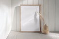 Portrait empty wooden frame mockup with modern ceramic vase, dry grass in sunlight, long shadows. White beadboard Royalty Free Stock Photo