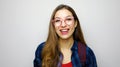 Portrait of energetic nerd teenager girl isolated on white background laughing happily as if anticipating friendly meeting or