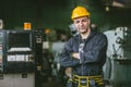 portrait engineer male technician expert skillful senior staff worker confident standing arm crossed with machinery factory Royalty Free Stock Photo
