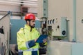 Portrait of engineer male using tablet while checking machines in industrial factory. Royalty Free Stock Photo