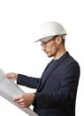 Portrait of an engineer in a white construction helmet with a paper drawing in hands.