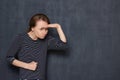 Portrait of enraged girl with clenched fist, looking into distance