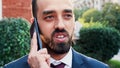 Portrait of entrepreneur man standing outside in front of startup office building Royalty Free Stock Photo