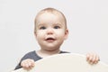 Portrait european caucasian happy smiling baby toddler with blue eyes on a white background looking above the camera Royalty Free Stock Photo