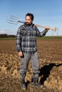 Portrait of a european Farmer with a pitchfork