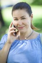 Portrait of European woman talking on mobile phone, head and shoulders Royalty Free Stock Photo