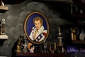 Portrait of Evel Knievel surrounded by trophies and memorabilia.