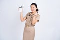 Portrait of excited Asian woman in brown uniform work clothes she holding calculator isolated on white background, Business and Royalty Free Stock Photo