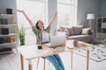 Portrait of excited cheerful recruiter girl sit chair raise hands accomplishment spacious bright workplace inside Royalty Free Stock Photo