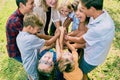 Excited children team heaping hands in summer Royalty Free Stock Photo