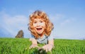 Portrait of a excited funny boy in the park. Funny little boy playing in garden backyard laughing and having fun. Summer Royalty Free Stock Photo