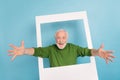 Portrait of excited funny granddad raise opened hands camera you invite isolated on blue color background