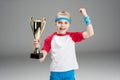 Portrait of excited girl holding champion`s goblet