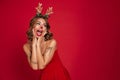 Portrait of an excited happy girl wearing christmas deer costume Royalty Free Stock Photo