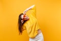 Portrait of excited joyful happy young woman in fur sweater white pants holding heart orange glasses isolated on bright Royalty Free Stock Photo