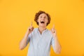 Portrait of excited joyful man 20s laughing and pointing fingers Royalty Free Stock Photo
