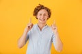 Portrait of excited joyful man 20s laughing and pointing fingers Royalty Free Stock Photo