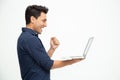 Portrait of an excited man holding laptop computer Royalty Free Stock Photo