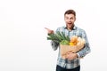 Portrait of an excited man holding paper bag Royalty Free Stock Photo