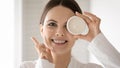 Portrait of smiling woman recommend moisturizing facial cream Royalty Free Stock Photo