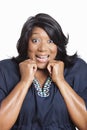 Portrait of excited mixed race woman over white background