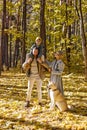 Portrait of excited optimistic family in park in the evening, sunny weather Royalty Free Stock Photo