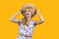 Portrait of excited smiling mature woman wearing dress and straw summer hat. Royalty Free Stock Photo