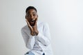 Portrait of excited young African American male screaming in shock and amazement. Royalty Free Stock Photo