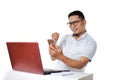 Portrait of excited Young Asian man sitting near laptop on the desk successfully completed the work as online freelancer Royalty Free Stock Photo