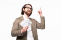 Portrait of an excited young businessman dressed in suit showing money banknotes isolated over gray background Royalty Free Stock Photo