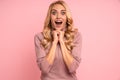 Portrait of an excited young casual girl screaming isolated over pink background Royalty Free Stock Photo