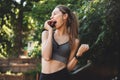 Portrait of an excited young fitness girl biting an apple Royalty Free Stock Photo