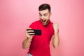 Portrait of an excited young man playing games