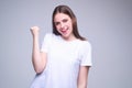 Portrait of excited young woman with amazed expression, excited face. Emotion people. Excited girl doing winner gesture Royalty Free Stock Photo