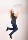 Excited woman jumping or flying with white umbrella Royalty Free Stock Photo