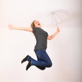 Excited woman jumping or flying with white umbrella Royalty Free Stock Photo