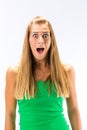 Excited young woman in green tanktop