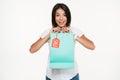 Portrait of an excited young woman holding sale shopping bag Royalty Free Stock Photo