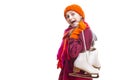 Portrait of Exclaiming Caucasian Girl in Winter Clothes Posing with Ice Skates In Both Hands Against Pure White Background Royalty Free Stock Photo