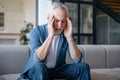 Portrait of exhausted mature man with closed eyes, suffering from headache disease Royalty Free Stock Photo