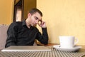 Portrait of exhausted worker sleeping on his desktop.