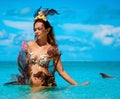 Portrait of exotic fantasy mermaid in blue ocean Royalty Free Stock Photo