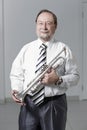 Portrait.experienced teacher of music with a trumpet
