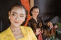Group of woman in traditional javanese costume performing dance