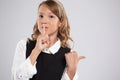 Portrait of an expressive beautiful young girl who put her finger to her lips to create a gesture of silence Royalty Free Stock Photo