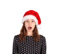 Portrait of expressive shocked and surprised woman. emotional girl in santa claus christmas hat isolated on white background. holi Royalty Free Stock Photo