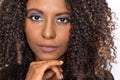 Extreme closeup of afro hairstyle black woman looking confident at camera with serious expression